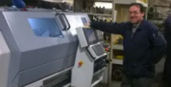 Ian Salter, Director of Precision Components Manufacturing Limited with his new Harrison Alpha 1400XS manual/cnc lathe