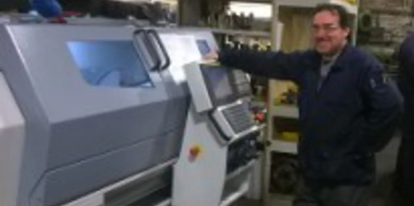 Ian Salter, Director of Precision Components Manufacturing Limited with his new Harrison Alpha 1400XS manual/cnc lathe
